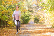 © Pixel-Shot - Sporty woman training in park on autumn day