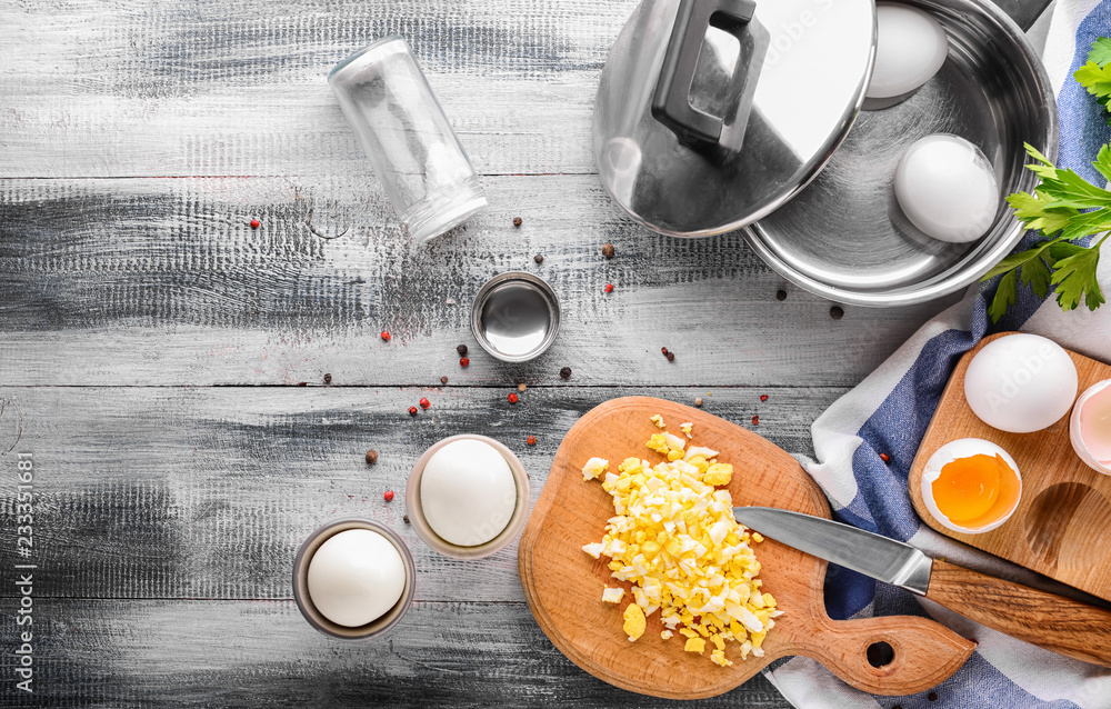 Composition with eggs on wooden table
