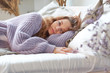 © yavdat - red-haired girl stretches into bed. wake up early in the morning, lazy weekend.