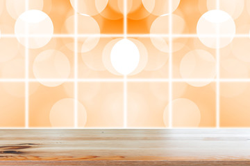 Wall Mural - Wooden desk with Gradient Abstract Blurred orange tone lights background