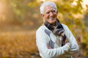 Poster - Happy senior man in autumn park