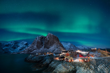 fisherman village with aurora in the background travel concept world explore northern light / lofote