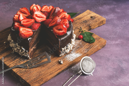 Chocolate Cake Decorated With Fresh Strawberries On A Cutting