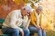 © pikselstock - Senior man suffering from a headache, senior woman comforts him
