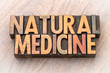 natural medicine text in wood type