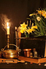 Wall Mural - Antique Magic Book. Witchcraft Peacock feathers and candle background. Black candle Magic Ritual.