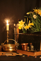 Wall Mural - Antique Magic Book. Witchcraft Peacock feathers and candle background. Black candle Magic Ritual.