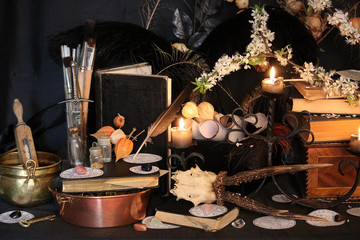 Wall Mural - Black candle Magic Ritual. Antique Magic Book. Witchcraft  Peacock feathers and candle background.