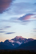Snowy Mountain Peak Under Sunset Clouds with Negative Space
