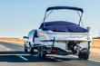 canvas print picture - Truck towing a  boat on the interstate, California