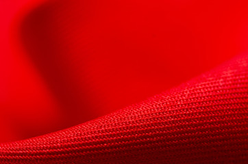 red fabric material texture on blur background