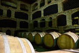 Fototapeta  - Cellars with barrels for wine production in an old, traditional way.