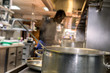 © Nicolas Faramaz - Cooking pot with a restaurant chef in the background