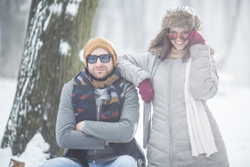 Poster - Young couple in snow outdoors