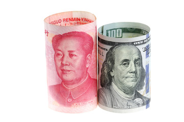 close up on US dollar and Chinese RMB bills isolated on white background