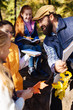 © zinkevych - Biology teacher. Positive bearded man talking to his pupils while taking them to the forest