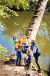 © zinkevych - So interesting. Top view of joyful nice children standing around their teacher while looking at the picture