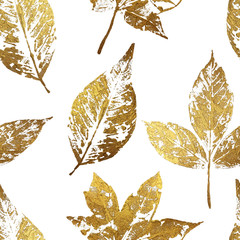 Gold leaf seamless pattern on white background. Leaf print with gold acrylic paint. Holiday decoration in style grunge.