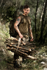 Wall Mural - Young woodcutter in the woods