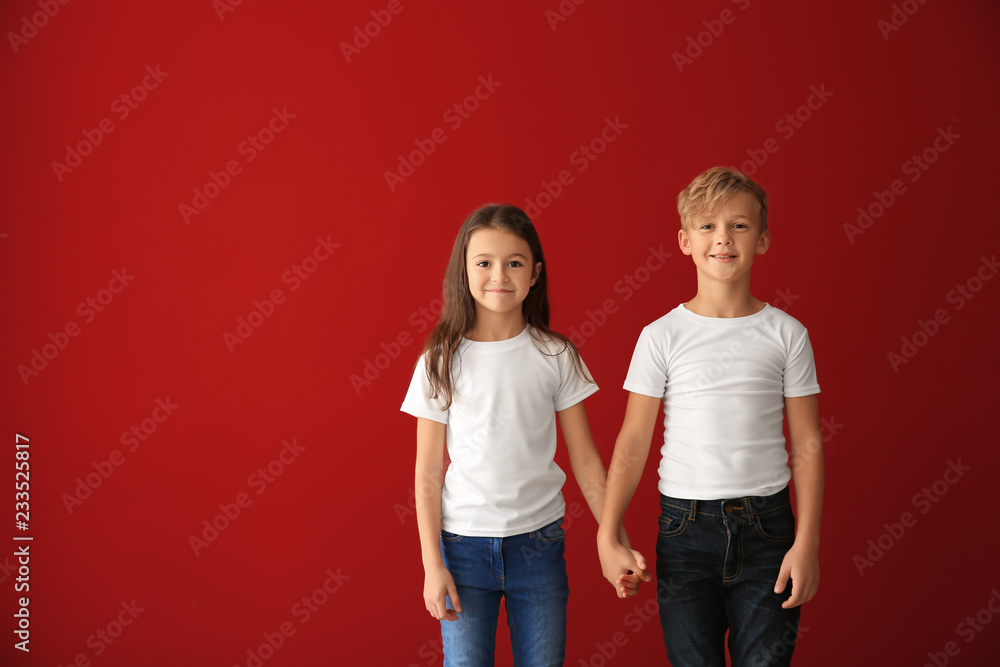 Cute children in t-shirts on color background