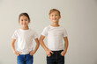 © Pixel-Shot - Cute children in t-shirts on light background