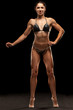 © vladimirfloyd - Pretty muscular young woman posing on black background