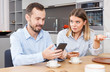 © JackF - Irritated spouses with phones