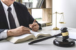 Law, lawyer attorney and justice concept, male lawyer or notary working on a documents and report of the important case in the workplace office