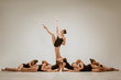© master1305 - The group of modern ballet dancers dancing on gray studio background