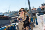 Fototapeta Młodzieżowe - Fashion blogger wearing dark black sunglasses and leather shirt
