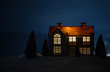 © zef art - wooden house in winter forest at night