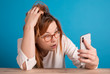 © vegefox.com - stressed girl looking on smartphone