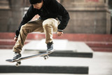 Full length of man performing skateboard stunt at skateboard park
