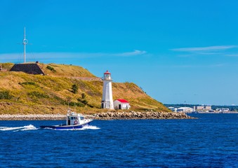 Wall Mural - Fishing Boat Past Small Lighthouse