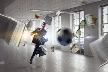 Wall Mural - Playing football in office. Mixed media