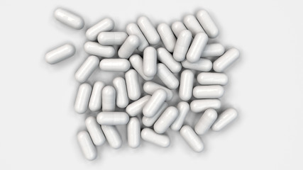 Pile of white medicine capsules