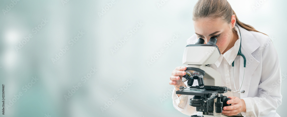 Scientist researcher using microscope in laboratory. Medical healthcare technology and pharmaceutical research and development concept. - obrazy, fototapety, plakaty 