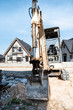 © Deyan Georgiev - Excavator and new built houses