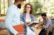 © NDABCREATIVITY - Group of college students studying at library