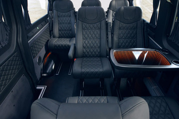 Wall Mural - Luxury leather seats in the van. Interior of luxury minivan with open doors