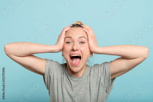 overexcited and enthusiastic woman screaming with happiness Poster Mural XXL