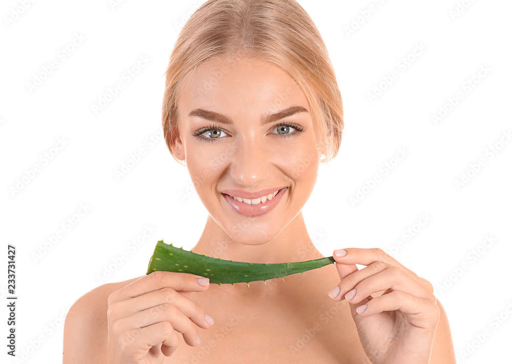 Beautiful young woman with aloe vera on white background