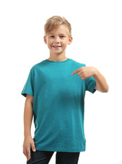 Cute boy pointing at his t-shirt on white background