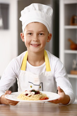 Sticker - Cute little chef with tasty dish in kitchen