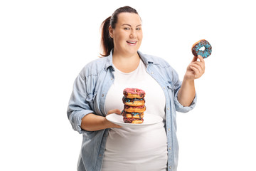 Canvas Print - Overweight woman with a pile of donuts