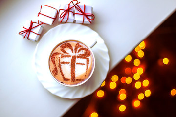 Christmas cappuccino with a gift picture