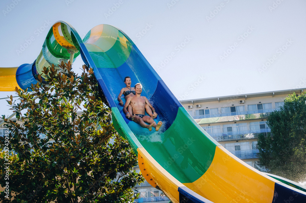 Water Ride Splashing Funny couple taking a fast water ride on a float splashing water ...