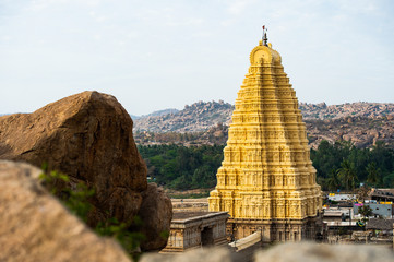 Wall Mural - (Selective focus) Beautiful Virupaksha temple at sunset in Hampi, Karnataka, India.