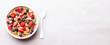 Granola Cereal bar with Strawberries and blueberries  on the Gray Background . Muesli Breakfast. Healthy Food sweet dessert snack. Diet Nutrition Concept. Top View. Copy space. Banner.