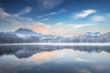 Hintersee, awesome Alpine Lake in Germany,  Ramsau National park, Berchtesgadener, Bavaria. Grosses Hauselhorn mountain peak in backdrop, Austria. Picturesque morning view of reflections in water.